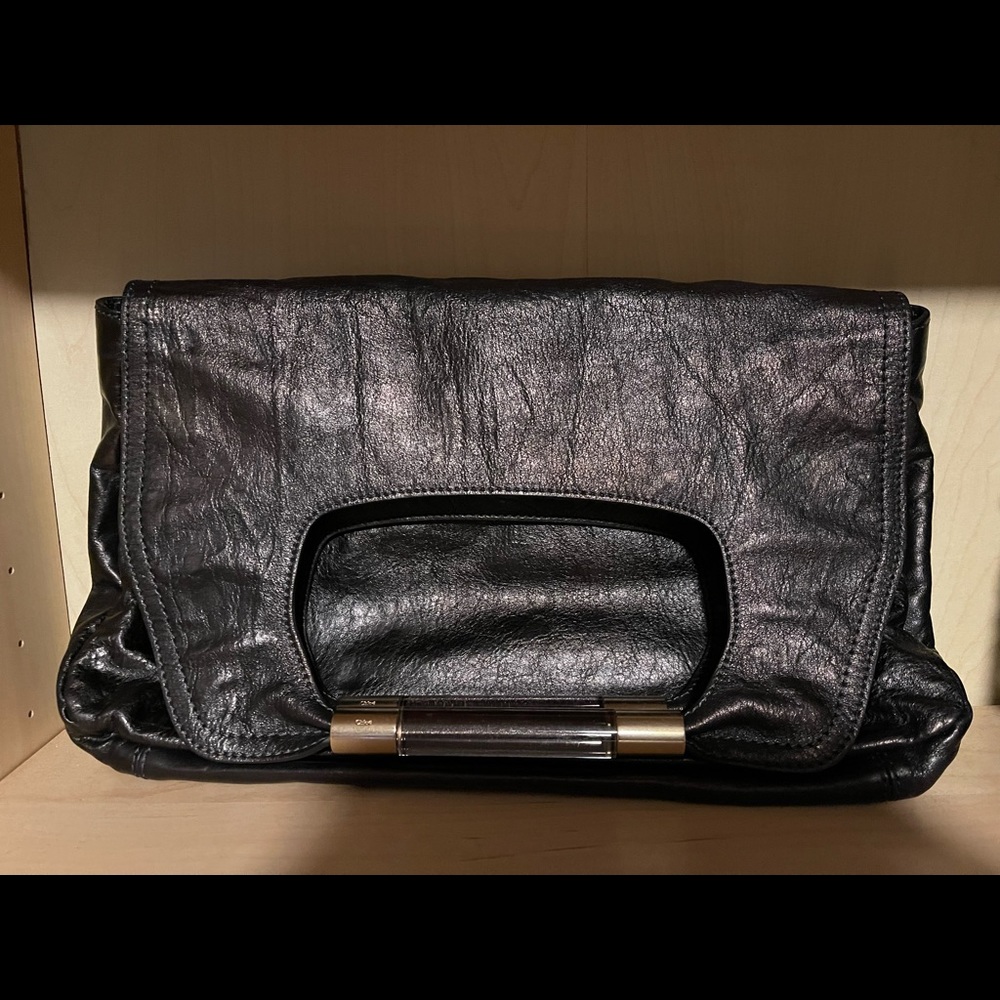Chloe Clutch pre owned with Chloe on glass handles. Black leather 9x14